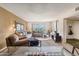 A well-lit living room with large sliding doors to a patio, comfortable couches, and neutral colors offers relaxed living at 3655 N 5Th Ave # 202, Phoenix, AZ 85013