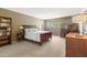 Spacious main bedroom with large window for natural light, desk space and a warm inviting atmosphere at 3655 N 5Th Ave # 202, Phoenix, AZ 85013