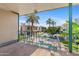 Patio view overlooking landscaped courtyard and pool with palm trees at 3655 N 5Th Ave # 202, Phoenix, AZ 85013