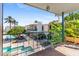 Balcony view overlooking a community pool and lush tropical landscaping at 3655 N 5Th Ave # 202, Phoenix, AZ 85013