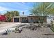 Charming single-story home with desert landscaping, covered front entry, and a spacious driveway leading to garage at 3837 E Yale St, Phoenix, AZ 85008