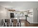 Updated kitchen features white cabinets, stainless steel appliances, granite countertops, and an eat-in bar at 3837 E Yale St, Phoenix, AZ 85008
