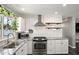Modern kitchen equipped with stainless steel appliances, granite countertops, and white subway tile backsplash at 3837 E Yale St, Phoenix, AZ 85008