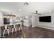 An open-concept layout showcasing the living area seamlessly connected to the kitchen and breakfast bar seating at 3837 E Yale St, Phoenix, AZ 85008