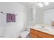 Bright bathroom features a single sink vanity, decor, and a toilet at 4341 E Abraham Ln, Phoenix, AZ 85050