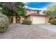 Charming two-story home featuring a two car garage and neutral color scheme with a cozy front porch at 4341 E Abraham Ln, Phoenix, AZ 85050