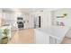 Bright kitchen with stainless steel appliances, quartz countertops and tile flooring at 4341 E Abraham Ln, Phoenix, AZ 85050
