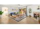 Bright living room featuring a sliding glass door, fireplace, and open floor plan at 4341 E Abraham Ln, Phoenix, AZ 85050