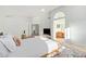 Bright main bedroom with ensuite bath, large bed, and plenty of natural light at 4341 E Abraham Ln, Phoenix, AZ 85050