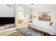 Spacious main bedroom with a large bed, ensuite bathroom, and natural light at 4341 E Abraham Ln, Phoenix, AZ 85050