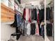 Walk-in closet with built-in shelving and ample storage space for clothes and accessories at 43803 W Wade Dr, Maricopa, AZ 85138