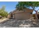 Single-story home featuring desert landscaping, a two-car garage, and neutral stucco facade at 43803 W Wade Dr, Maricopa, AZ 85138