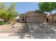 Attractive single-Gathering home featuring xeriscaping, an attached two-car garage, and neutral color palette at 43803 W Wade Dr, Maricopa, AZ 85138