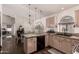 This kitchen's island opens to the dining area and offers a seamless cooking and dining experience at 43803 W Wade Dr, Maricopa, AZ 85138