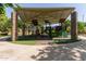 Community playground with covered play structure and multiple activities for entertainment at 43803 W Wade Dr, Maricopa, AZ 85138