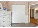 Charming bedroom features whimsical wallpaper, closet, and classic chest of drawers at 4430 E Creosote Dr, Cave Creek, AZ 85331