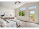 Sunlit bedroom features vaulted ceilings, multiple windows, and access to an outdoor balcony at 4430 E Creosote Dr, Cave Creek, AZ 85331