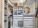 Walk-in closet features custom shelving, drawers, and ample storage for organizing clothing and accessories at 4430 E Creosote Dr, Cave Creek, AZ 85331