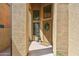 Inviting front entrance features a decorative door, potted plants, and textured facade at 4430 E Creosote Dr, Cave Creek, AZ 85331