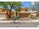 Desert home features a tile roof, mature landscaping, and a two-car garage at 4430 E Creosote Dr, Cave Creek, AZ 85331