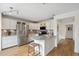 Bright kitchen boasts stainless steel appliances, marble countertops, and light wood flooring at 4430 E Creosote Dr, Cave Creek, AZ 85331