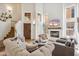 Bright living room features soaring ceilings, a cozy fireplace, and elegant furnishings at 4430 E Creosote Dr, Cave Creek, AZ 85331
