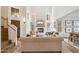 Sunlit living room features soaring ceilings, a cozy fireplace, and elegant furnishings at 4430 E Creosote Dr, Cave Creek, AZ 85331