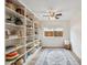 Office featuring floor-to-ceiling bookshelves, a ceiling fan, and a view of the backyard at 4430 E Creosote Dr, Cave Creek, AZ 85331