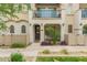 Charming two-story townhome featuring a welcoming front porch and upper-level balcony at 4637 S Jetty --, Mesa, AZ 85212