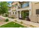 Exterior view of townhomes featuring stucco facades, balconies, and neat landscaping at 4637 S Jetty --, Mesa, AZ 85212