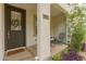 Inviting front porch with seating area, landscaped plants, and a welcoming entrance at 4637 S Jetty --, Mesa, AZ 85212