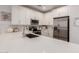 Bright kitchen features stainless steel appliances, ample white cabinetry, quartz countertops, and subway tile backsplash at 4637 S Jetty --, Mesa, AZ 85212