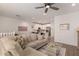 Spacious living room with open floor plan leading to kitchen, featuring stylish decor at 4637 S Jetty --, Mesa, AZ 85212