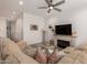 Inviting living room featuring a fireplace, neutral decor, and a comfortable sectional at 4637 S Jetty --, Mesa, AZ 85212