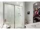 Modern shower with glass doors, bright tile, and bench creates a clean and inviting spa-like experience at 4637 S Jetty --, Mesa, AZ 85212