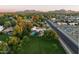 Expansive property featuring a sparkling private pool, lush greenery, and stunning mountain views at 5202 E Larkspur Dr, Scottsdale, AZ 85254