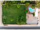 Lush backyard showcases a sparkling pool, mature landscaping, and ample space for outdoor recreation at 5202 E Larkspur Dr, Scottsdale, AZ 85254