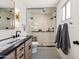 Modern bathroom showcasing a glass-enclosed shower, double vanity, and stylish fixtures at 5202 E Larkspur Dr, Scottsdale, AZ 85254