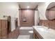 Stylish bathroom with a combined tub/shower, modern fixtures, and elegant tiling at 5202 E Larkspur Dr, Scottsdale, AZ 85254