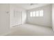 Sunny bedroom with ceiling fan, shutters, and closet space at 5202 E Larkspur Dr, Scottsdale, AZ 85254