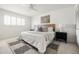 Serene bedroom features a ceiling fan, plantation shutters, and neutral decor at 5202 E Larkspur Dr, Scottsdale, AZ 85254