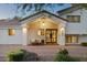 Inviting entryway with a covered porch, stylish lighting, and a modern steel front door at 5202 E Larkspur Dr, Scottsdale, AZ 85254