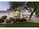 Elegant home with a covered entryway, manicured landscaping, and updated architectural details at 5202 E Larkspur Dr, Scottsdale, AZ 85254