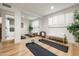 Bright and airy home gym with mirrored wall, yoga mats, and a view of the en suite bathroom for convenient workouts at 5202 E Larkspur Dr, Scottsdale, AZ 85254