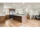Spacious kitchen boasts custom cabinets, stainless steel appliances, large island, and ample counter space at 5202 E Larkspur Dr, Scottsdale, AZ 85254