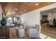 Open-concept living area with wood floors, recessed lighting, and a view of the kitchen and dining space at 5202 E Larkspur Dr, Scottsdale, AZ 85254