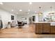 Bright, open living room featuring a modern design, recessed lighting, and hardwood flooring at 5202 E Larkspur Dr, Scottsdale, AZ 85254