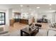Inviting open-concept living space with hardwood floors flowing from the kitchen to the living and dining areas at 5202 E Larkspur Dr, Scottsdale, AZ 85254