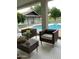 Covered patio featuring comfortable seating with views of a sparkling in-ground pool at 5202 E Larkspur Dr, Scottsdale, AZ 85254