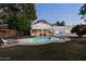 Backyard pool with covered patio and mature landscaping at 5202 E Larkspur Dr, Scottsdale, AZ 85254